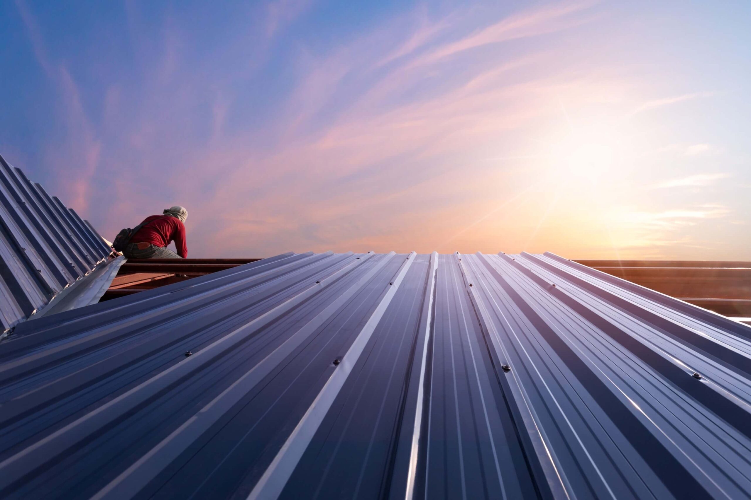 Construction worker installing a new roof